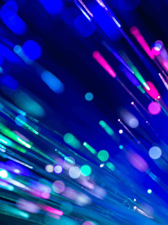 A photograph of fibre optic strands against a dark background